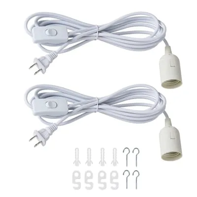 Two white plug-in pendant light cords with switches and sockets